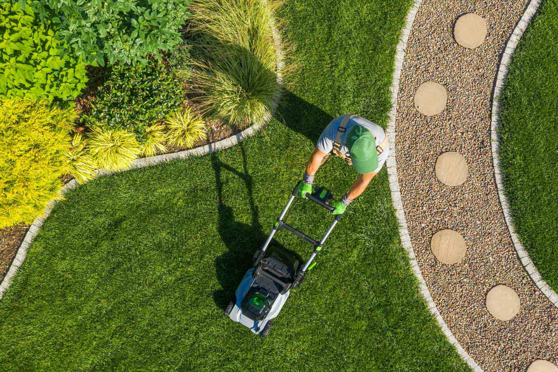 Gardener Mowing Backyard Garden Grass Aerial View