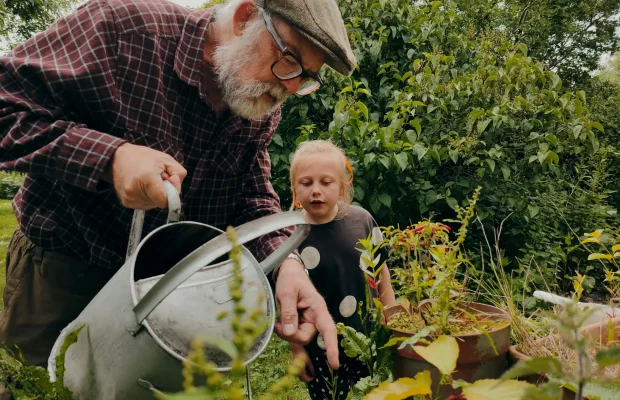 Gardening-Lifestyle-Grandfather-Granddaughter-Watering