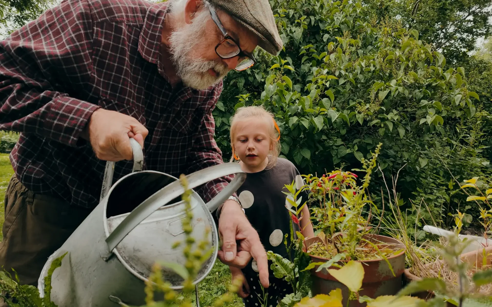 Gardening-Lifestyle-Grandfather-Granddaughter-Watering